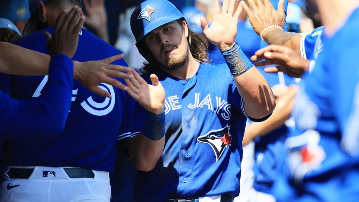 Toronto Blue Jays third baseman Addison Barger (47) celebrates after scoring during the fourth inning against the Atlanta Braves at TD Ballpark.
