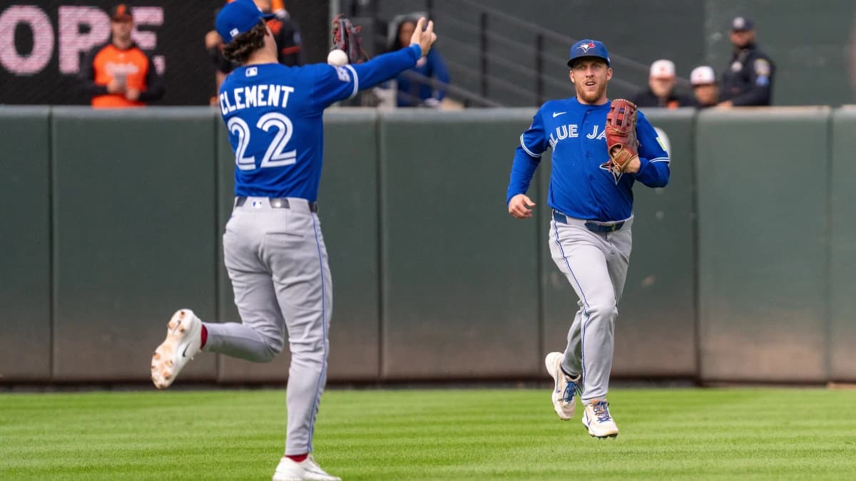 Toronto Blue Jays outfielder Myles Straw (3) looks on as Toronto Blue Jays infielder Ernie Clement (22) attempts to catch a pop fly at Oriole Park at Camden Yards.