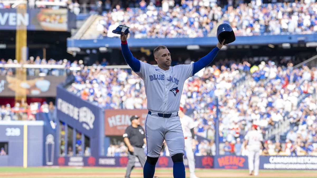 Toronto Blue Jays designated hitter George Springer (4) waves to the fans after being replaced in the during the third inning against the Cincinnati Reds at Rogers Centre.