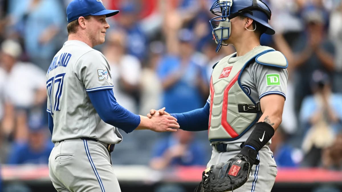 Toronto Blue Jays pitcher Louis Varland (77) celebrates with catcher Brandon Valenzuela (59) after the Blue Jays beat the Cleveland Guardians at Progressive Field.