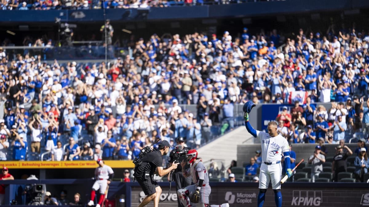 Toronto Blue Jays George Springer (4) waves to the fans before taking an at-bat against the Cincinnati Reds during the first inning at Rogers Centre.