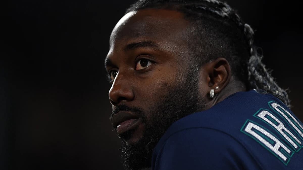 Seattle Mariners outfielder Randy Arozarena (56) looks on from the dugout in the ninth inning against the Colorado Rockies at Coors Field.