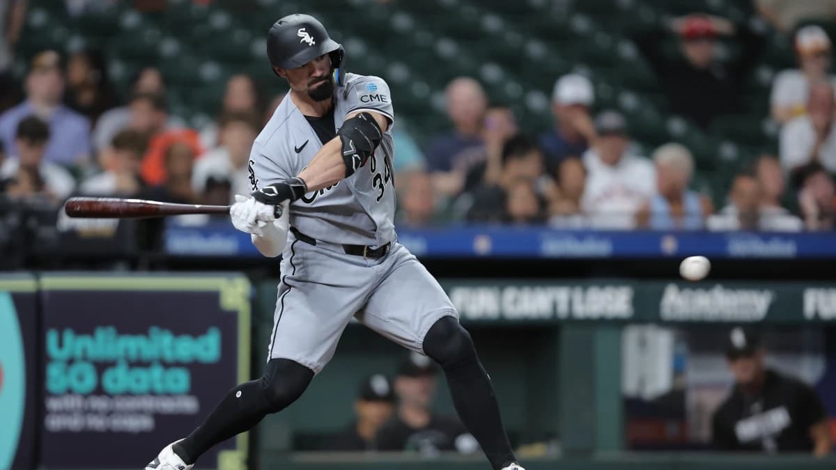 Chicago White Sox designated hitter Randal Grichuk (34) hits an RBI double during the seventh inning against the Houston Astros at Daikin Park