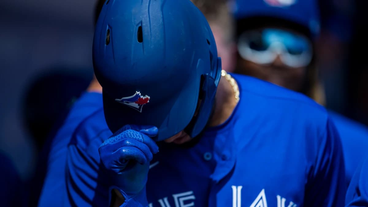 Toronto Blue Jays left fielder Lourdes Gurriel Jr. (13) removes his helmet in the dugout after scoring during a game between the Toronto Blue Jays and the Baltimore Orioles at TD Ballpark.