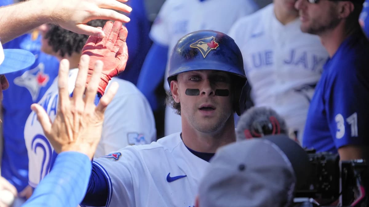Toronto Blue Jays shortstop Ernie Clement (22) gets congratulated after scoring against the Tampa Bay Rays during the first inning at Rogers Centre.