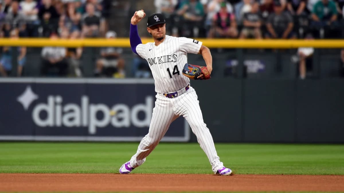 Colorado Rockies infielder Ezequiel Tovar (14) throws to first for an out in the first inning against the Seattle Mariners at Coors Field.
