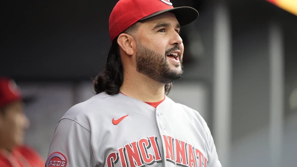 Cincinnati Reds designated hitter Eugenio Suarez (28) smiles in the dugout during the ninth inning against the Toronto Blue Jays at Rogers Centre.