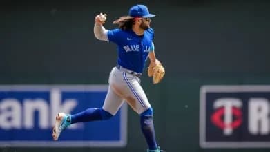 Bichette mid-throw for the Blue Jays