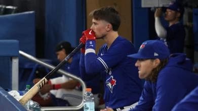 Cavan Biggio waiting in the dugout for his at-bat