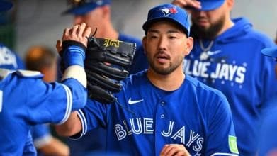 Yusei Kikushi celebrating with his Blue Jay teamates.