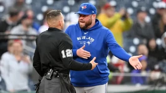 Toronto Blue Jays Manager John Schneider yelling at the umpire for missing a call.