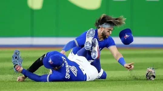 SS Bo Bichette colliding with RF George Springer.