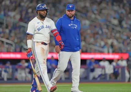 Vladimir Guerrero Jr. with Manager John Schneider