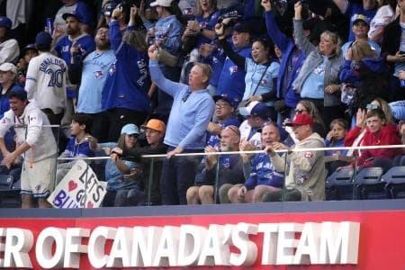 Toronto Blue Jays fans celebrate in the third inning against the Seattle Mariners during game two of the ALCS round for the 2025 MLB playoffs at Rogers Centre