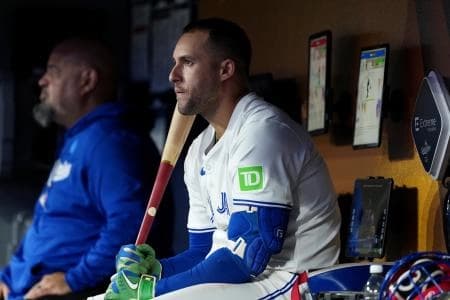 Toronto Blue Jays right fielder George Springer (4) looks on in the dugout in the eighth inning against the Los Angeles Dodgers during game one of the 2025 MLB World Series at Rogers Centre.
