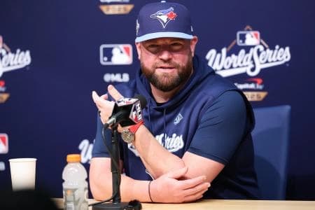 Toronto Blue Jays manager John Schneider (14) speaks at the postgame press conference after the game against the Los Angeles Dodgers during game four of the 2025 MLB World Series at Dodger Stadium.