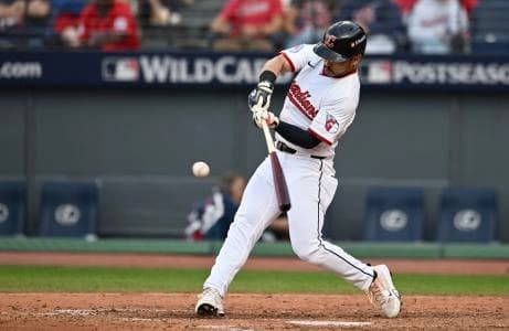 Cleveland Guardians outfielder Steven Kwan (38) hits a double in the eighth inning against the Detroit Tigers during game three of the Wildcard round for the 2025 MLB playoffs at Progressive Field.