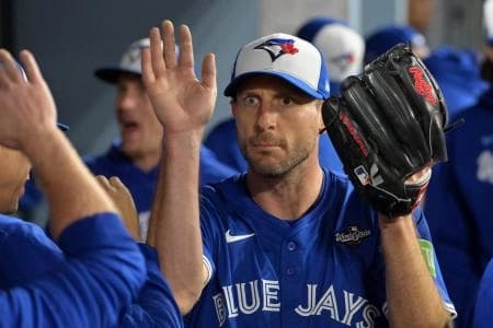 Toronto Blue Jays pitcher Max Scherzer (31) reacts in the dugout after being relieved in the fifth inning against the Los Angeles Dodgers during game three of the 2025 MLB World Series at Dodger Stadium.