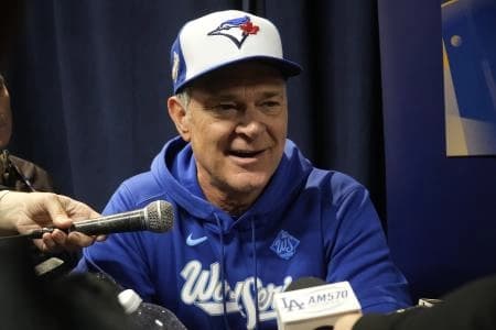 Toronto Blue Jays bench manager Don Mattingly smiles during media day before game 1 of the World Series at Rogers Centre.