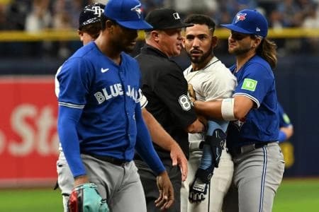 Tampa Bay Rays shortstop Jose Caballero (7) stares at Toronto Blue Jays relief pitcher Genesis Cabrera (92) after they collide in the seventh inning of the game at Tropicana Field.