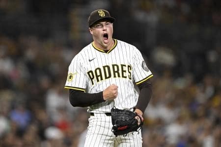 San Diego Padres relief pitcher Mason Miller (22) celebrates after striking out a batter during the eighth inning against the Cincinnati Reds at Petco Park.