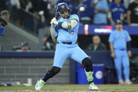 Toronto Blue Jays designated hitter Bo Bichette (11) avoids a pitch against the Los Angeles Dodgers in the sixth inning during game six of the 2025 MLB World Series at Rogers Centre.