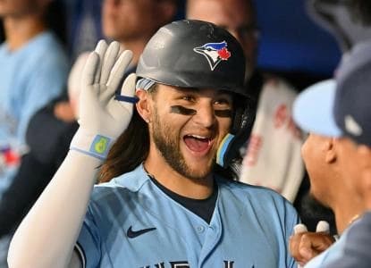 Toronto Blue Jays shortstop Bo Bichette (11) celebrates with team mates in the dugout after hitting a solo home run against the Chicago White Sox in the seventh inning at Rogers Centre.
