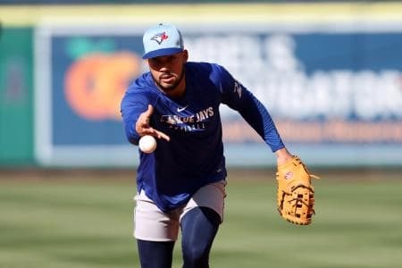 Toronto Blue Jays designated hitter Anthony Santander (25) tosses a ball before the game against the Los Angeles Angels at Angel Stadium.