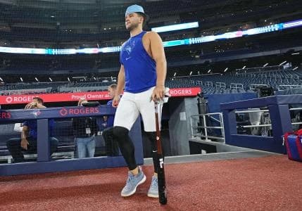 Toronto Blue Jays shortstop Bo Bichette (11) walks onto the field for batting practice before a game against the Cleveland Guardians at Rogers Centre.