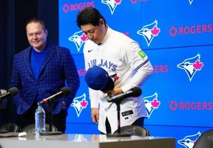 Toronto Blue Jays Kazuma Okamoto bows to the media at the end of the press conference at Rogers Centre