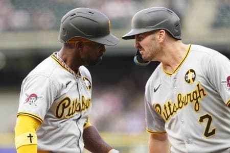 Pittsburgh Pirates designated hitter Andrew McCutchen (22) celebrates his three run home run with first baseman Spencer Horwitz (2) in the first inning against the Colorado Rockies at Coors Field.