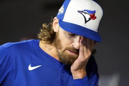Toronto Blue Jays pitcher Kevin Gausman (34) reacts after being relieved in the sixth inning against the Seattle Mariners during game one of the ALCS round for the 2025 MLB playoffs at Rogers Centre.