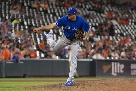 Toronto Blue Jays relief pitcher Derek Law (64) delivers a pitch in the ninth inning against the Baltimore Orioles at Oriole Park at Camden Yards.