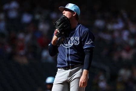 Tampa Bay Rays pitcher Garrett Cleavinger (60) reacts to a bases loaded hit by pitch against the Minnesota Twins during the seventh inning at Target Field.