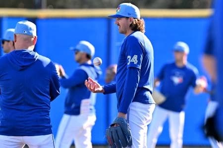 Toronto Blue Jays pitcher Kevin Gausman (34) takes a break during spring training at the Bobby Mattick Training Center at Englebert Complex.