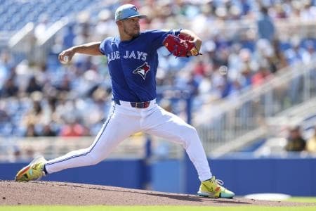 Toronto Blue Jays starting pitcher Jose Berrios (17) throws a pitch against the Pittsburgh Pirates in the first inning during spring training at TD Ballpark.