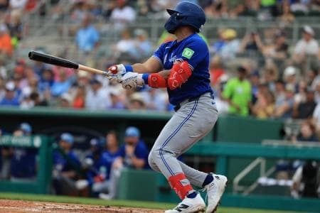 Toronto Blue Jays infielder Leo Jimenez (49) hits an RBI single during the first inning at JetBlue Park at Fenway South.