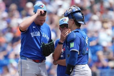 Toronto Blue Jays pitching coach Pete Walker (41) talks with pitcher Grant Rogers (69) and catcher Brandon Valenzuela (59) in the second inning against the New York Mets at Clover Park.