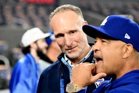 Toronto Blue Jays president Mark Shapiro speaks with Los Angeles Dodgers manager Dave Roberts (30) before game six of the 2025 MLB World Series at Rogers Centre.