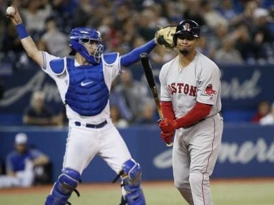 Boston Red Sox second baseman Marco Hernandez (40) reacts after striking out as Toronto Blue Jays catcher Reese McGuire (10) throws the ball back to the mound during the ninth inning at Rogers Centre.