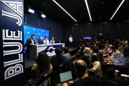 Toronto Blue Jays general manager Ross Atkins speaks to the media with Kazuma Okamoto during the press conference at Rogers Centre.