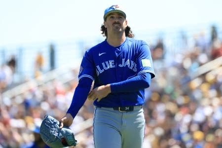 Toronto Blue Jays starting pitcher Kevin Gausman (34) walks back to the dugout at the end of the first inning against the Pittsburgh Pirates at LECOM Park.