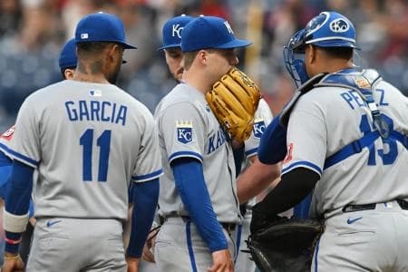 Kansas City Royals starting pitcher Ryan Bergert (38) talks to teammates on the mound during the third inning against the Cleveland Guardians at Progressive Field.