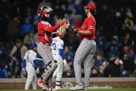 Los Angeles Angels catcher Logan O'Hoppe (14) celebrates with pitcher Jordan Romano (68) after their victory over the Chicago Cubs at Wrigley Field.
