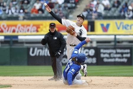 Chicago White Sox shortstop Colson Montgomery (12) throws out Toronto Blue Jays third baseman Addison Barger (47) at second base during the ninth inning at Rate Field.