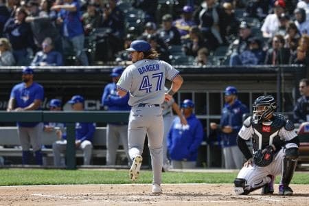 Toronto Blue Jays right fielder Addison Barger (47) scores against the Chicago White Sox during the second inning at Rate Field.