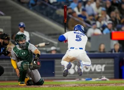 Toronto Blue Jays center fielder Daulton Varsho (5) takes a bat against the Athletics during the eighth inning at Rogers Centre.