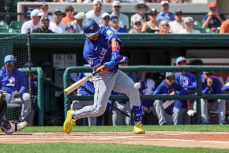 Toronto Blue Jays left fielder Jonatan Clase (8) hits during the first inning against the Detroit Tigers at Publix Field at Joker Marchant Stadium.