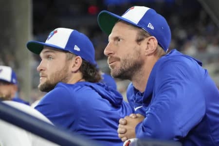 Toronto Blue Jays pitcher Trey Yesavage (39) and pitcher Max Scherzer (31) in the dugout before the start of the game against the Athletics at Rogers Centre.
