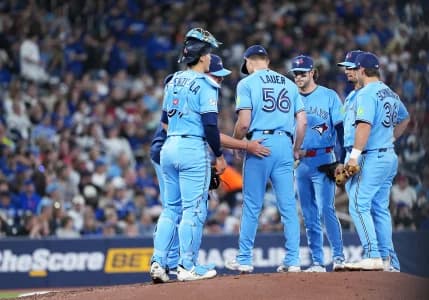Toronto Blue Jays starting pitcher Eric Lauer (56) is relieved by manager John Schneider (14) against the Minnesota Twins during he sixth inning at Rogers Centre.